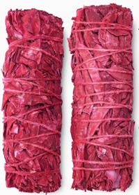 a pair of red sage sachets on a white background