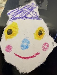 a drawing of a snowman on a piece of paper