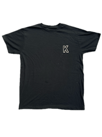 a black t - shirt with the letter k on it