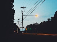 a street light in the middle of a dark street
