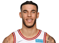 a basketball player with tattoos posing for a photo