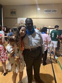 a man and a woman posing for a picture in a gym