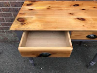 a wooden desk with drawers on it