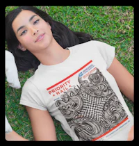a woman laying on the grass wearing a t - shirt