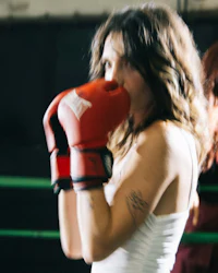a woman in a boxing ring