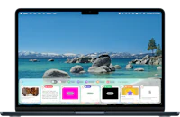 a laptop screen with a view of a lake and mountains