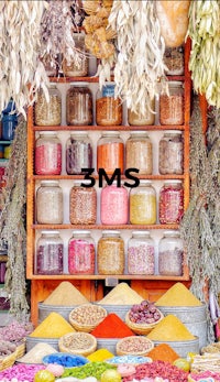 jars of spices are on display in a market