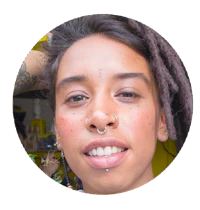 a woman with dreadlocks and piercings