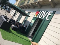 a cafe with a sign that says love on it