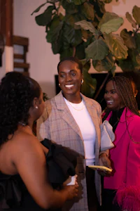 a group of women at an event talking to each other