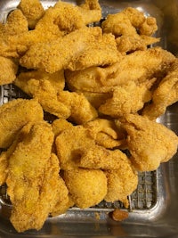 fried fish in a metal tray