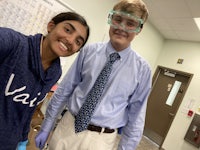 a man and a woman posing for a photo in a dental office