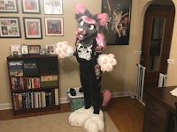 a cat mascot standing in a living room