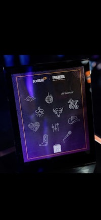 a framed display of esports icons on a table