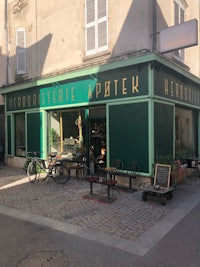 a building with a green awning