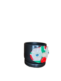 a black cup with a flower on it