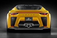 the rear end of a yellow sports car