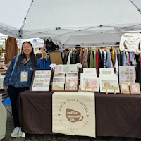 a woman standing in front of a tent