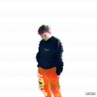 a man in a black sweater and orange pants