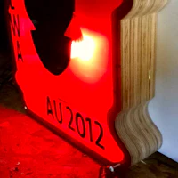 a red sign with a silhouette on it