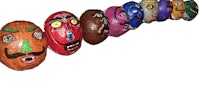 a row of colorful masks on a white background