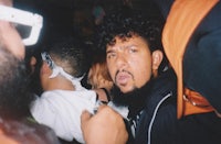 a man with a beard in a crowd
