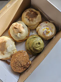 a box with a variety of donuts in it