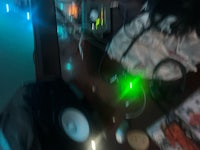a desk with a green light on it