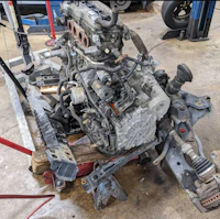 a car engine is sitting on a table in a garage