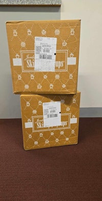 two boxes stacked on top of each other