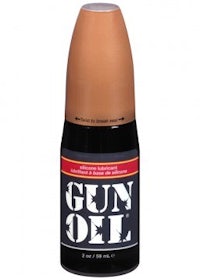 a bottle of gun oil on a white background