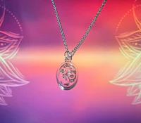 an om symbol necklace on a colorful background