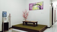a small room with a table and a water cooler