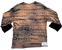 a long - sleeved shirt with chains on it