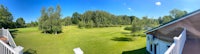 a view of a golf course from a fisheye lens