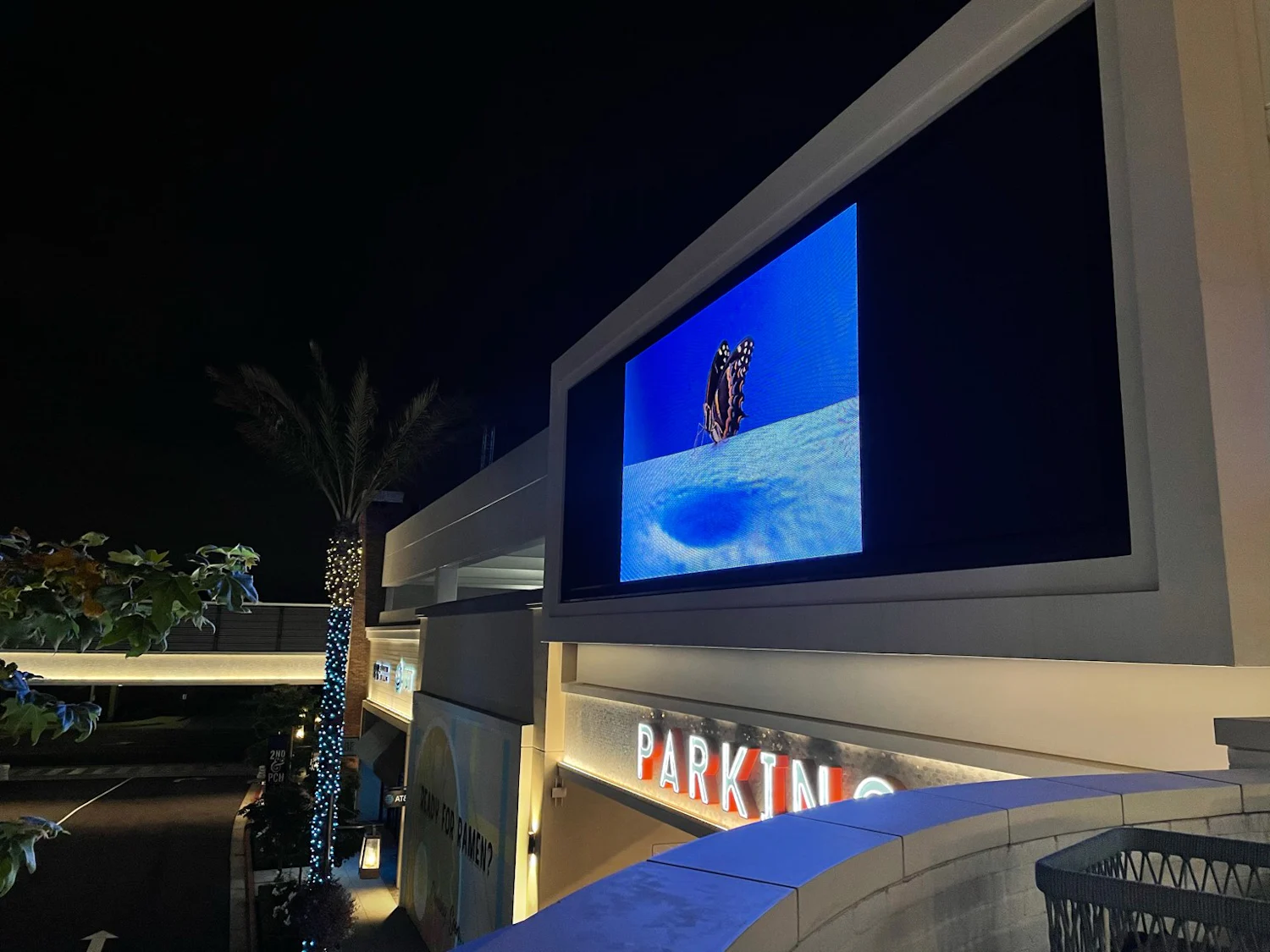 a large screen showing a picture of a man riding a bike