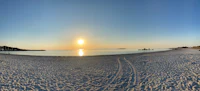 a 360 degree view of a beach at sunset