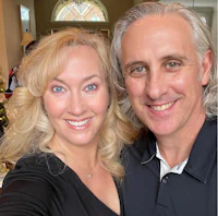 a man and woman posing for a selfie