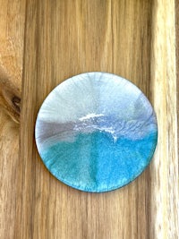 a blue and white plate on top of a wooden table