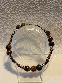 a bracelet with tiger eye beads and silver beads