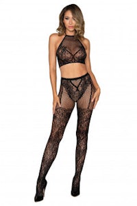 a woman in black lace stockings and a halter top