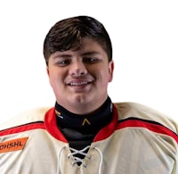 a young man in a hockey uniform smiling