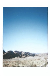 a polaroid photograph of a desert landscape