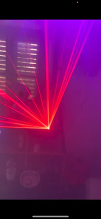 a red and purple laser light in a room