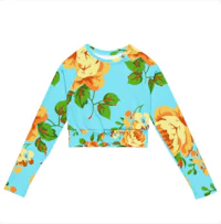 a women's cropped top with yellow and blue roses on it