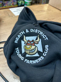 a hoodie with the words district farming young neil on it