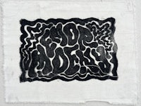 a piece of cloth with a black and white drawing on it
