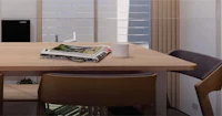 a wooden dining table with four chairs