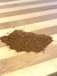 a brown powder on top of a wooden table