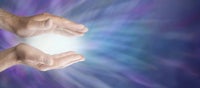 a man's hands with a light shining out of them